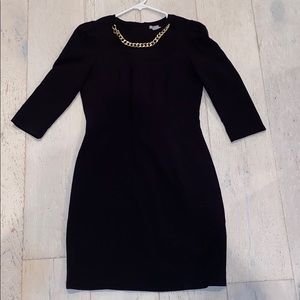 🎀 Perfect holiday mini dress with gold chain detail